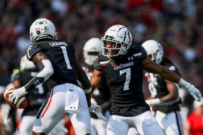 Cornerbacks Ahmad Gardner (#1) and Coby Bryant (#7) celebrate an interception.